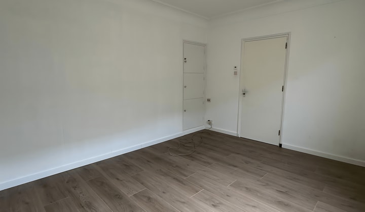 Gestoffeerde studentenkamer met tuin