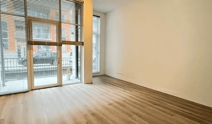 Appartement met balkon en gedeelde tuin