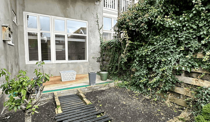 Gestoffeerd appartement met tuin en wassenmachine
